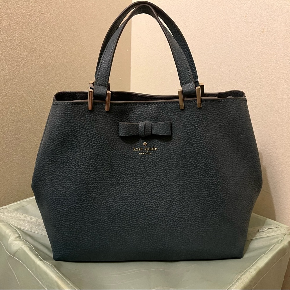 Kate Spade purse. Brand new with tag. Birthday present but not my style.